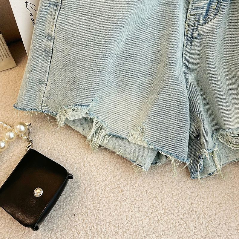 Shorts de mezclilla anchos rasgados
