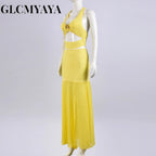 Conjunto de top corto con cuello halter y falda midi maxi con abertura lateral