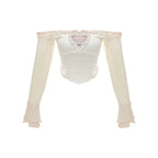 Conjunto de 3 piezas: chaleco con tirantes, top blanco con hombros descubiertos y falda beige con cintura elástica