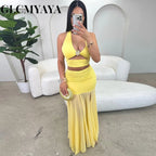 Conjunto de top corto con cuello halter y falda midi maxi con abertura lateral