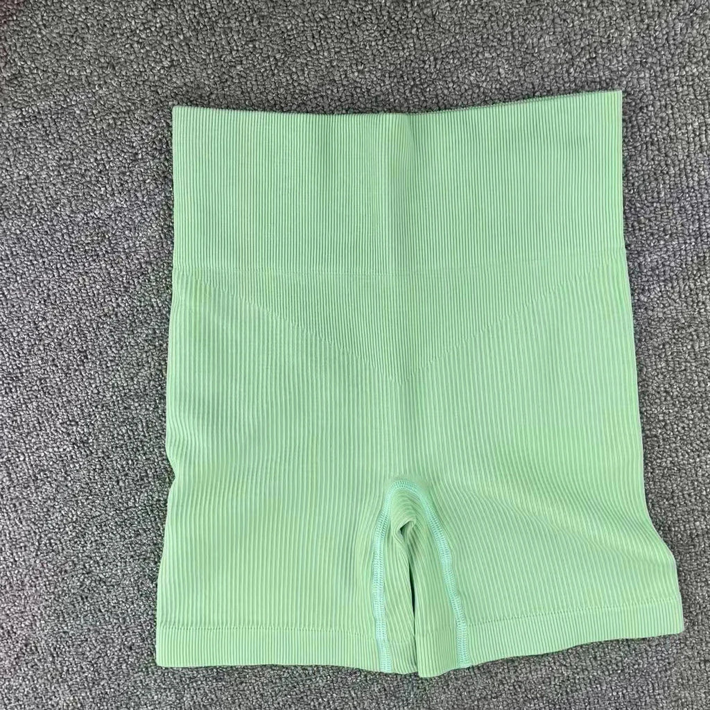 Pantalones cortos de punto acanalados para mujer, shorts de yoga sin costuras, shorts elásticos de cintura alta, shorts sexys para realzar la cadera, pantalones de tres cuartos para ciclismo y running.