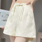 Pantalones cortos de satén jacquard con borlas