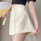 Pantalones cortos de satén jacquard con borlas