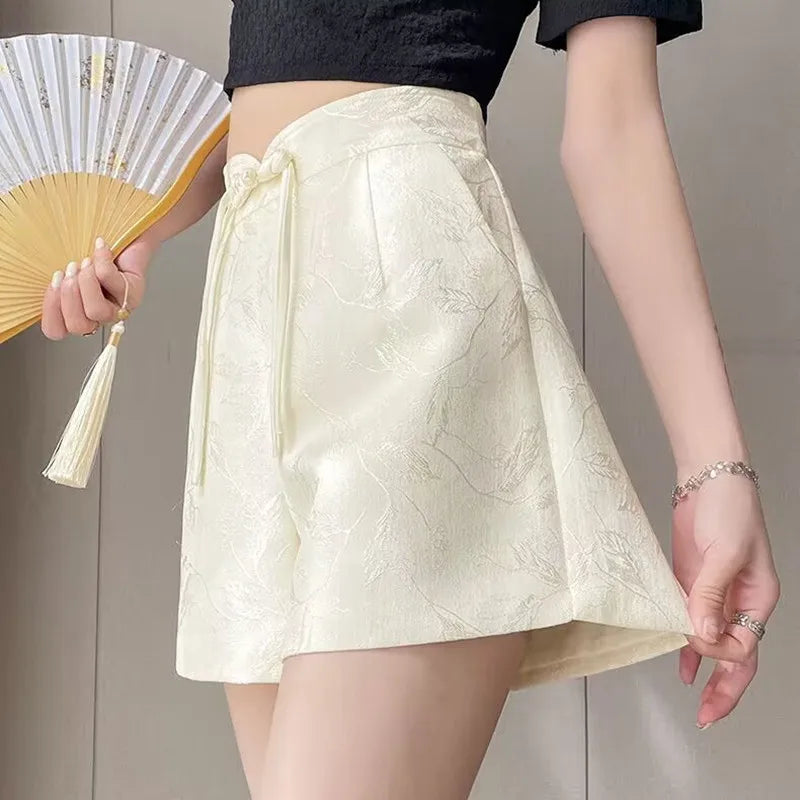 Pantalones cortos de satén jacquard con borlas