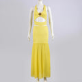 Conjunto de top corto con cuello halter y falda midi maxi con abertura lateral