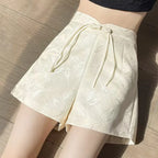 Pantalones cortos de satén jacquard con borlas