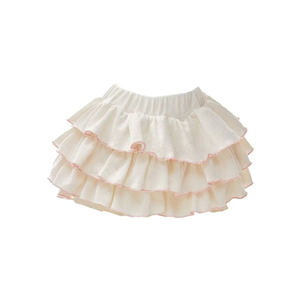 Conjunto de 3 piezas: chaleco con tirantes, top blanco con hombros descubiertos y falda beige con cintura elástica